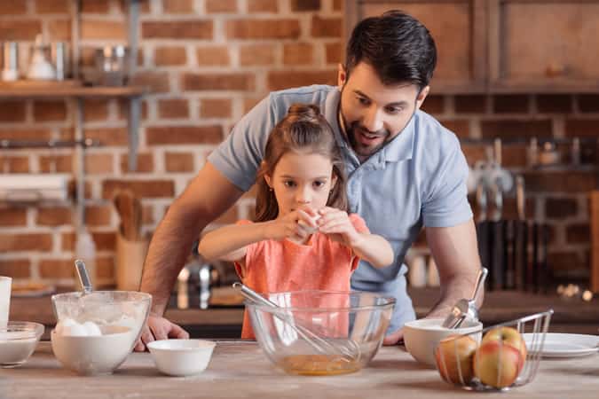 Man Baking With His Daughter