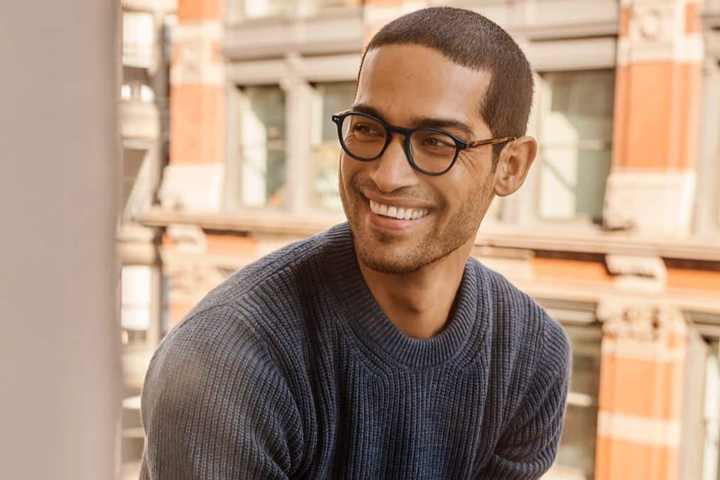 man wearing warby parker glasses