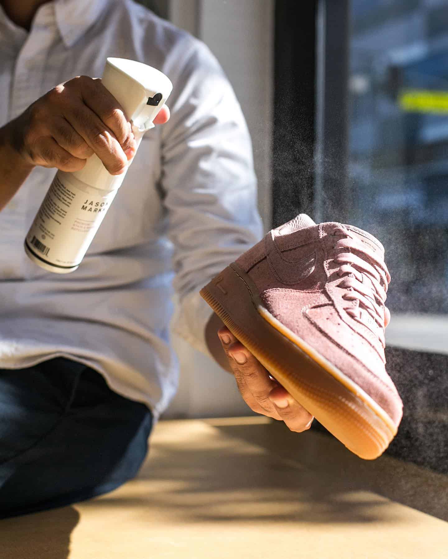 Applying a repel spray on a suede shoe