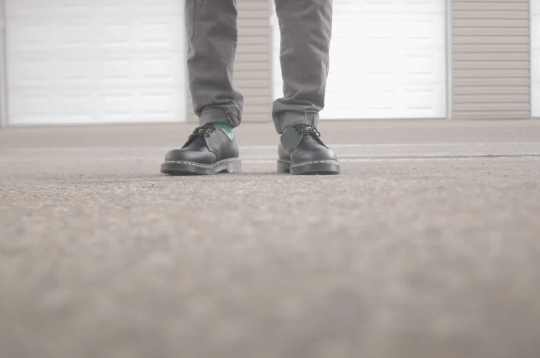 ground shot of a man wearing Dr Marten leather loafers