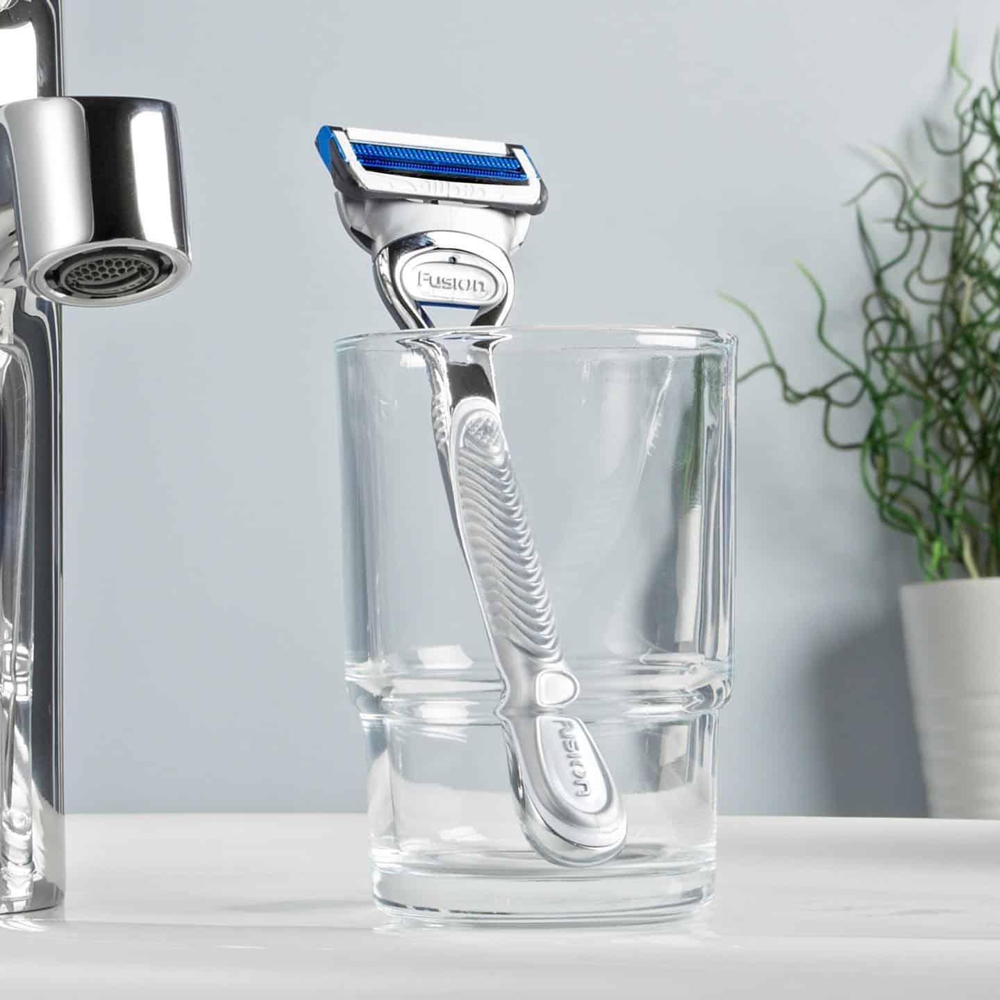 a gillette razor in a glass