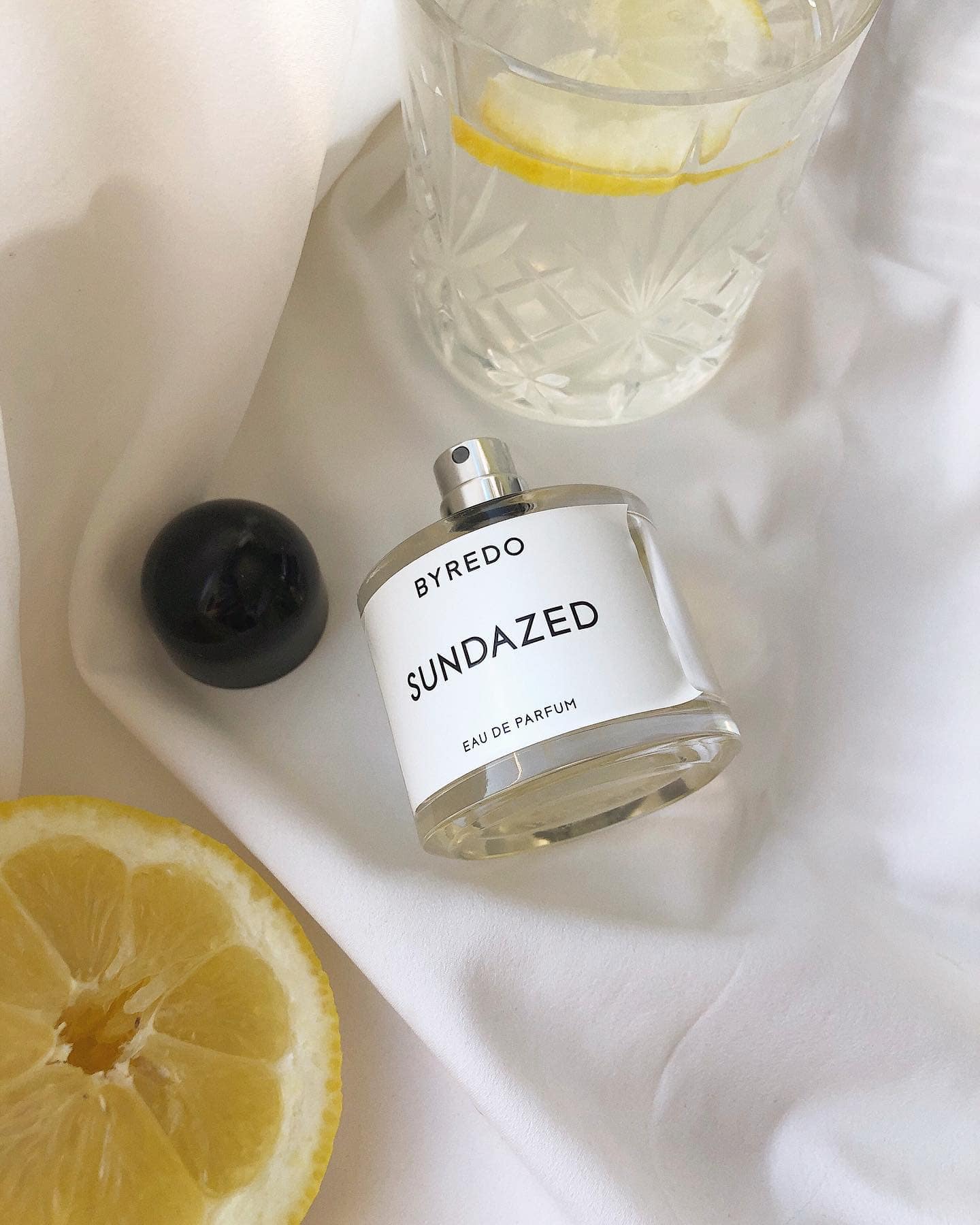 a bottle of byredo sundazed with the cap off