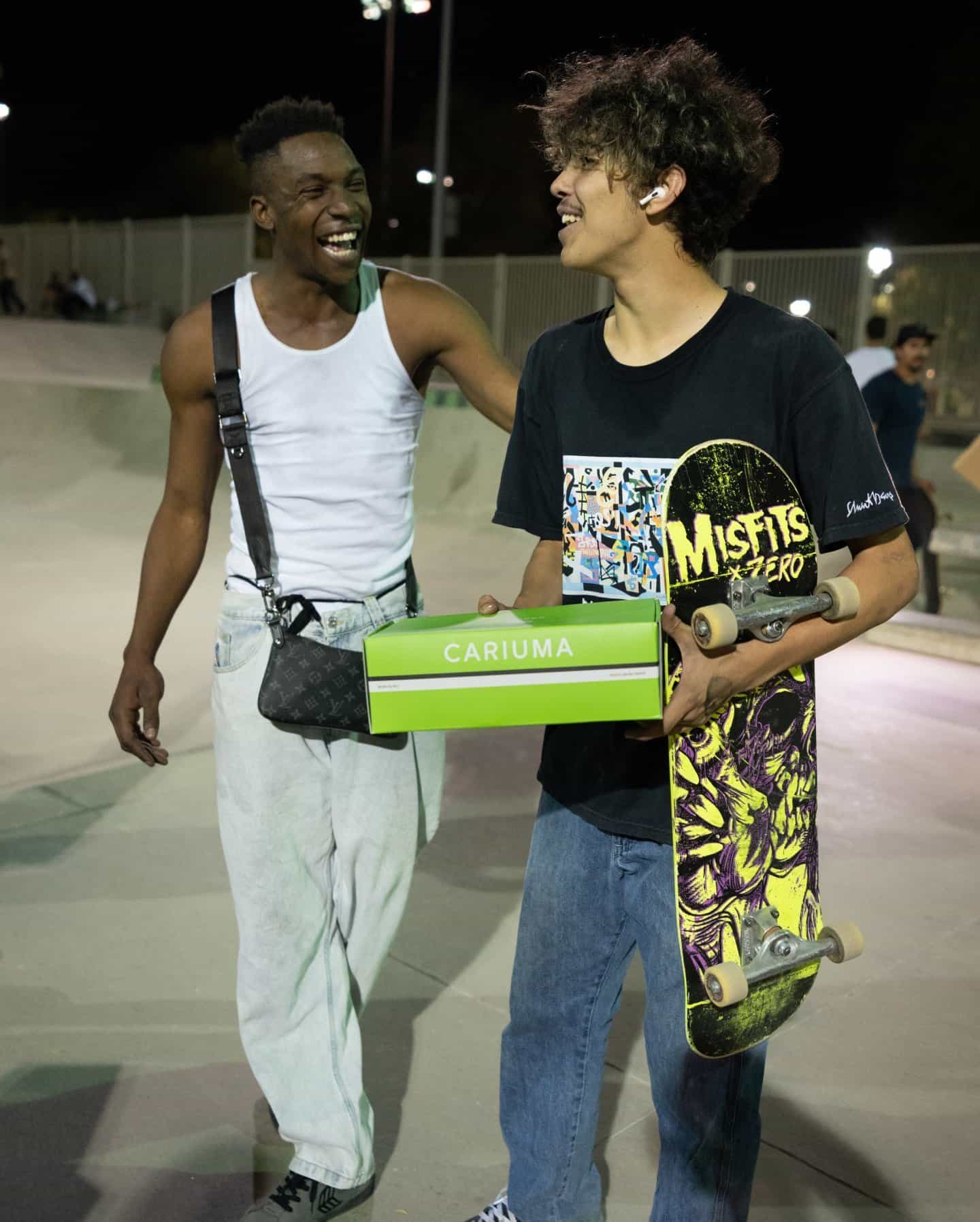 two men talking happily in a skate park