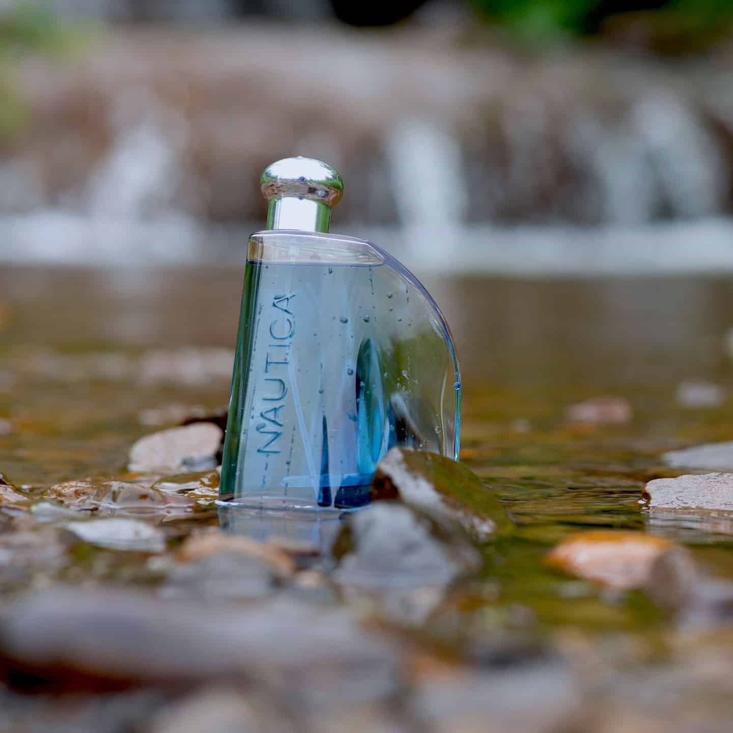 a bottle of nautica classic cologne on shallow waters