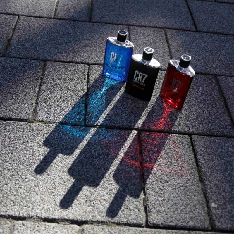 bottles of CR7 eau de toilette, Play it Coo land Game on casting shadows on the pavement