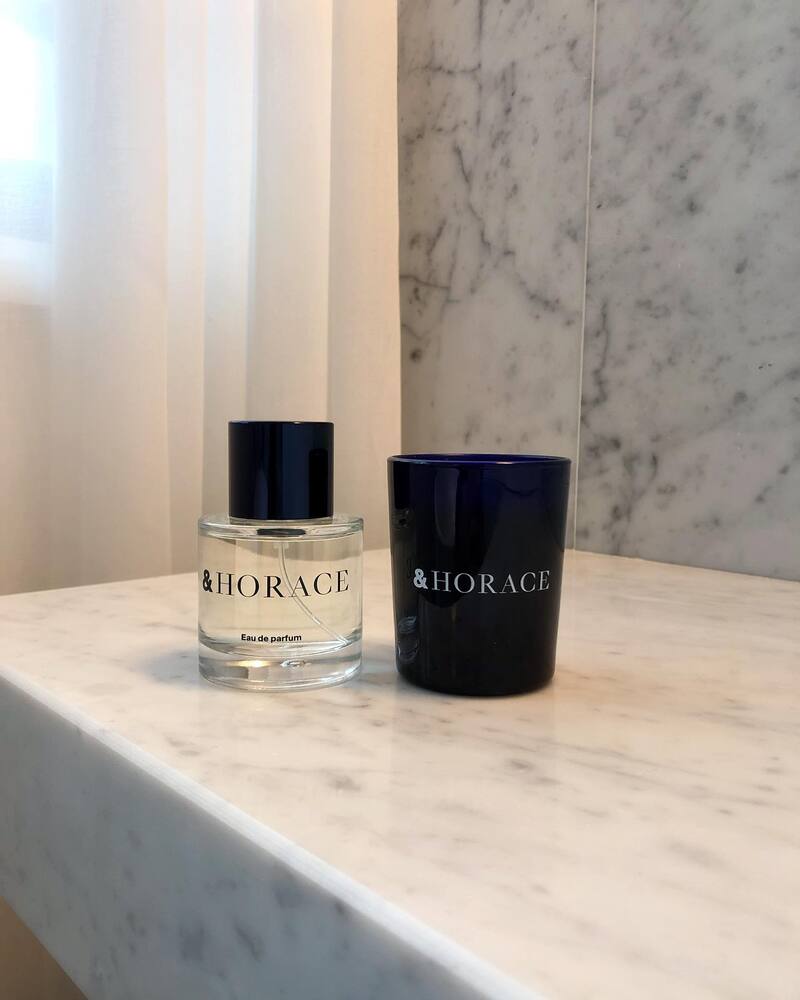 a bottle of &Horace Eau de Parfum and a candle