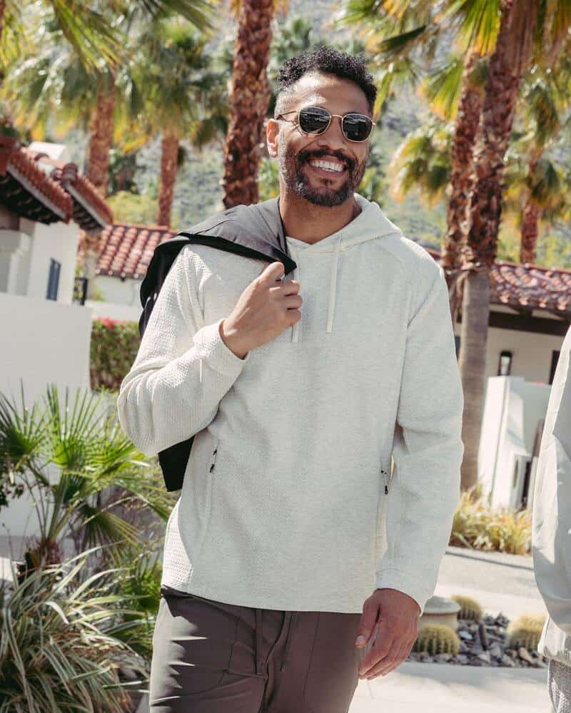 man with sunglasses wearing the Restoration Hoodie by 7Diamonds