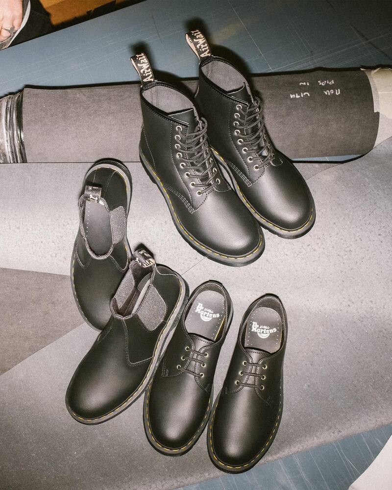 a collection of dr martens shoes and boots