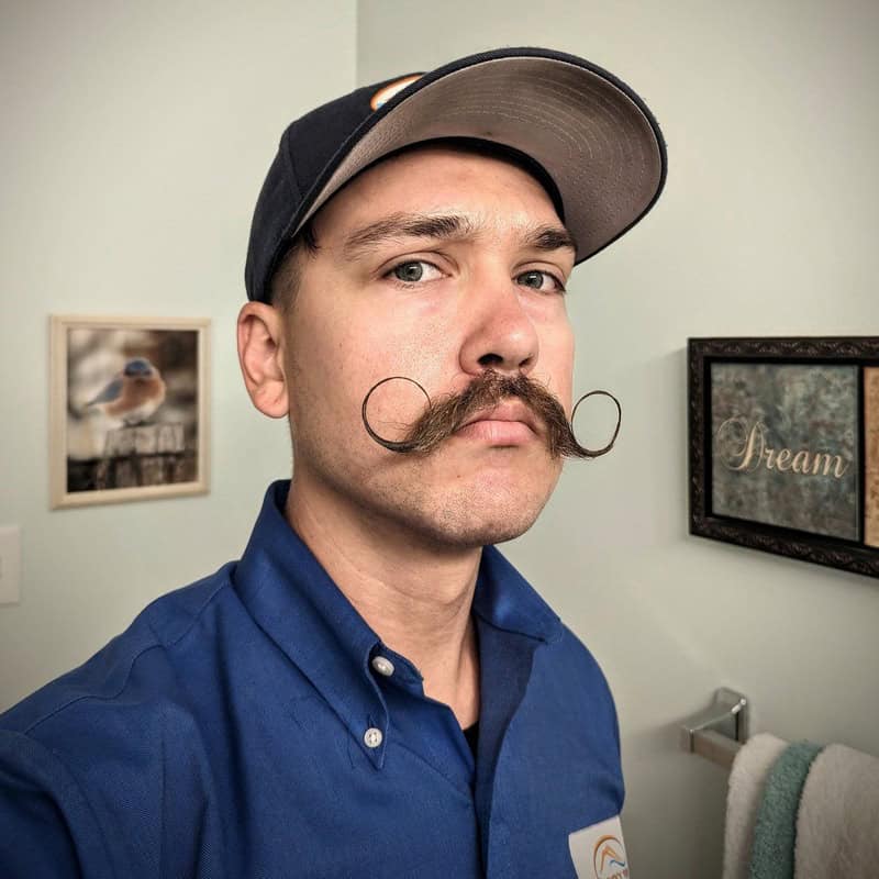 man with a handlebar style mustache