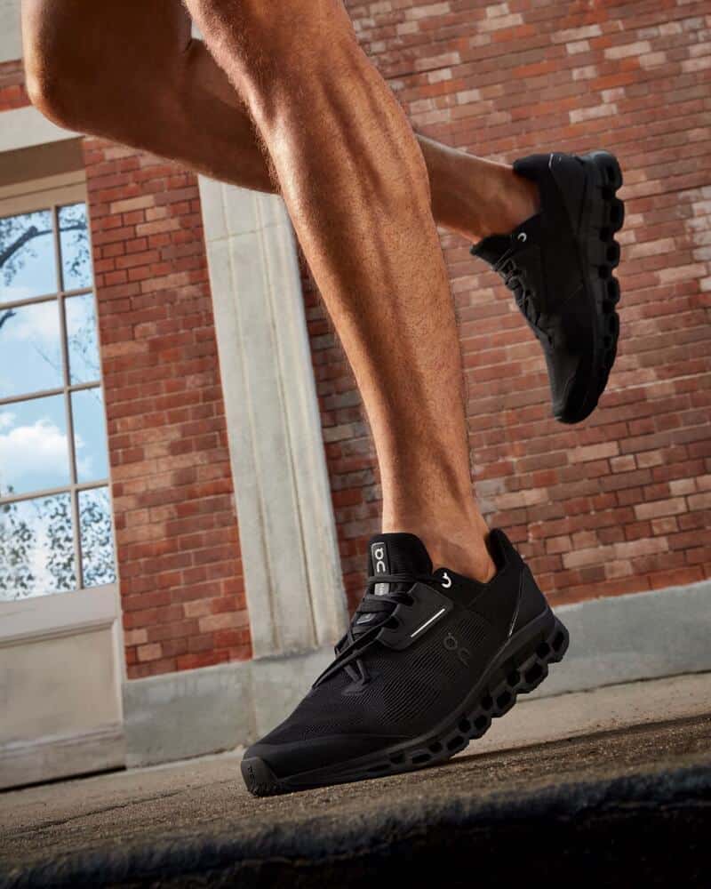 man running wearing a pair of cloud shoes