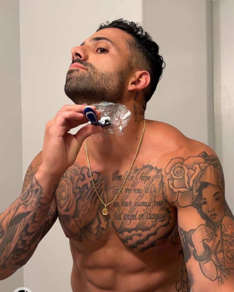 man shaving at the neck area