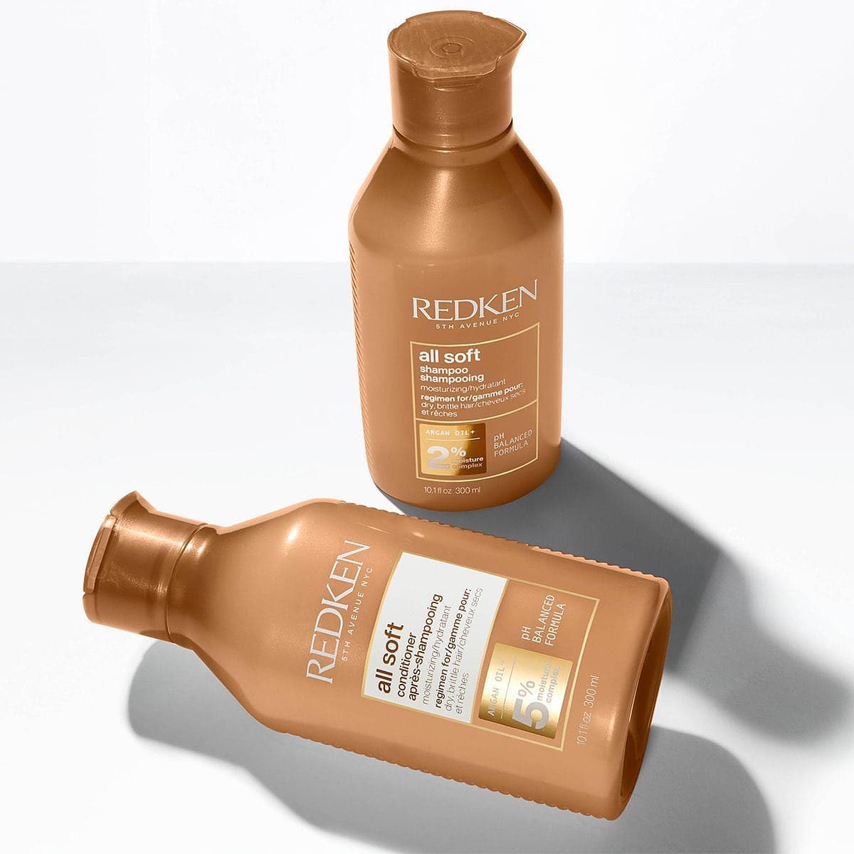 bottles of redken all soft shampoo and conditioner