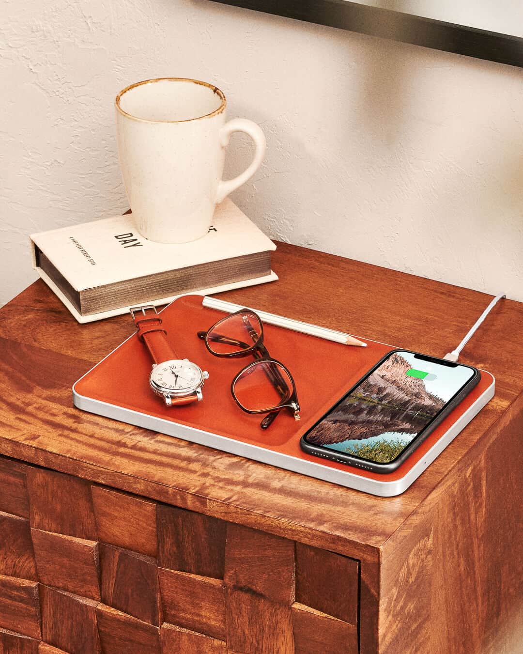 carl friedrik charging tray on top of a side table