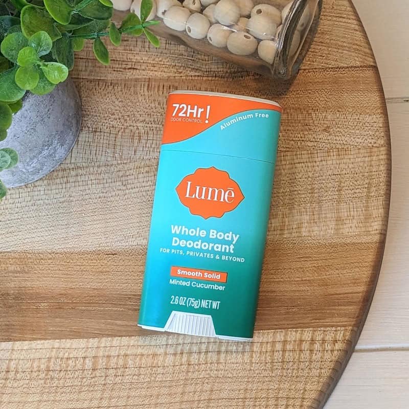 a Lume Whole Body Deodorant stick in Minted Cucumber Scent