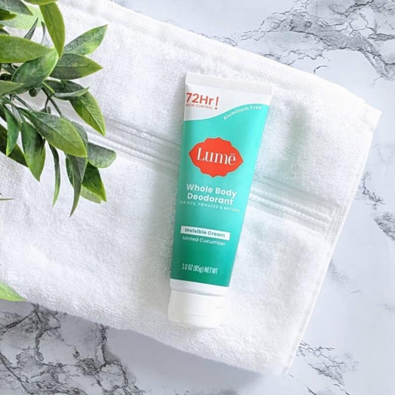 a tube of Lume Whole Body Deodorant cream in Minted Cucumber Scent